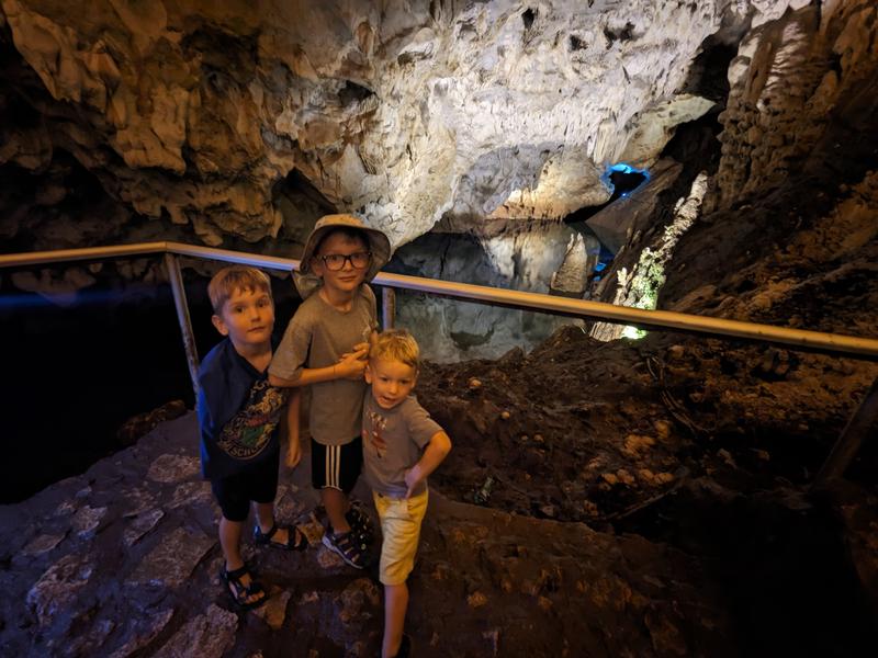 In the cave, in front of a lake