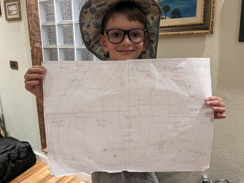 Ben holding up the map