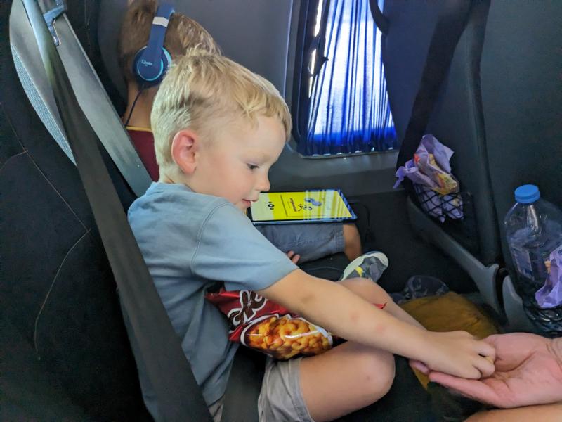 Max handing out "Smoki", peanut flavored, cheeto-like puffs