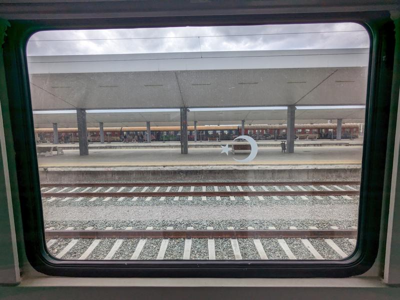 Turkey symbol looking out on the tracks.